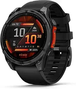 Garmin Fenix 8 smartwatch with vivid AMOLED display showing ski run speed and elevation data on a snowboarder's wrist against a snowy mountain background