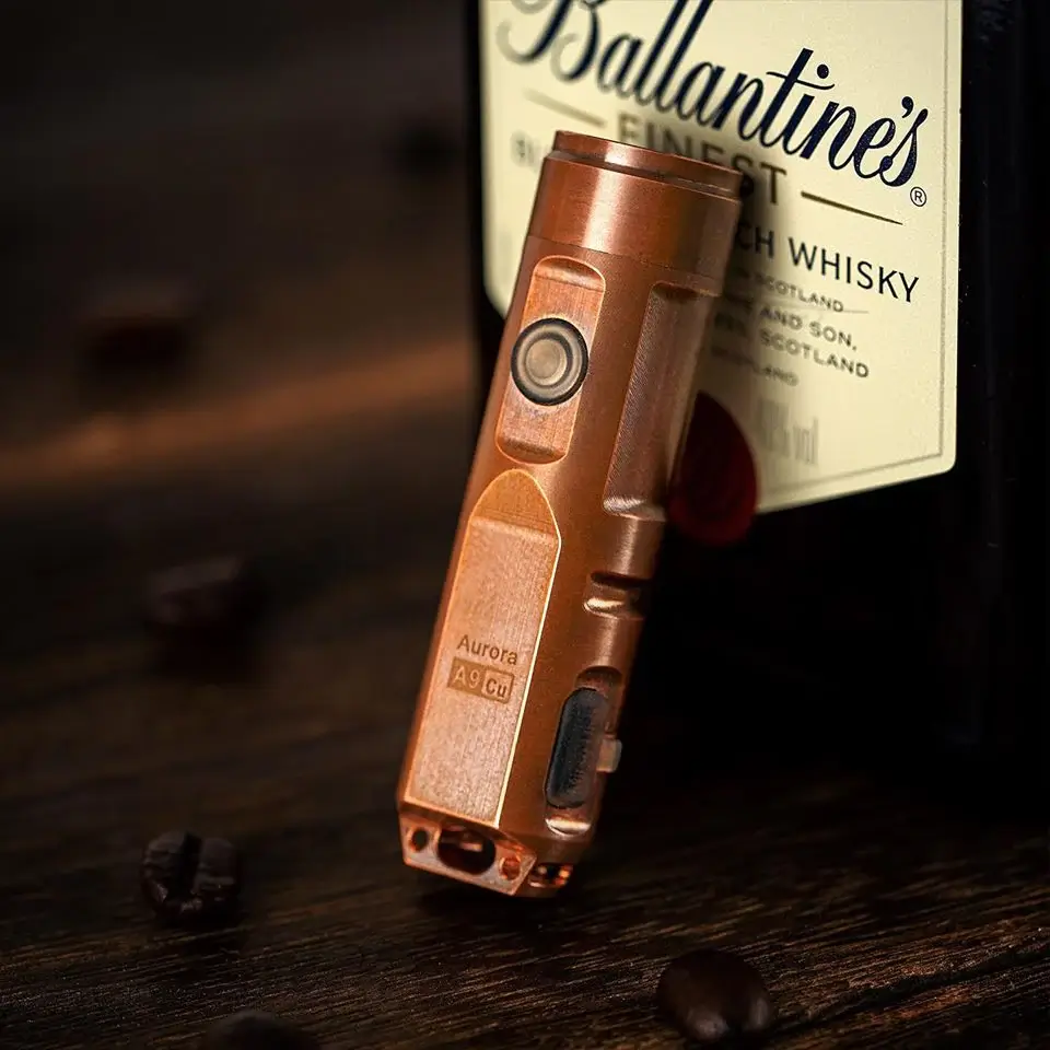 RovyVon Aurora A9 keychain flashlight in titanium finish showing USB-C port and auxiliary LED head